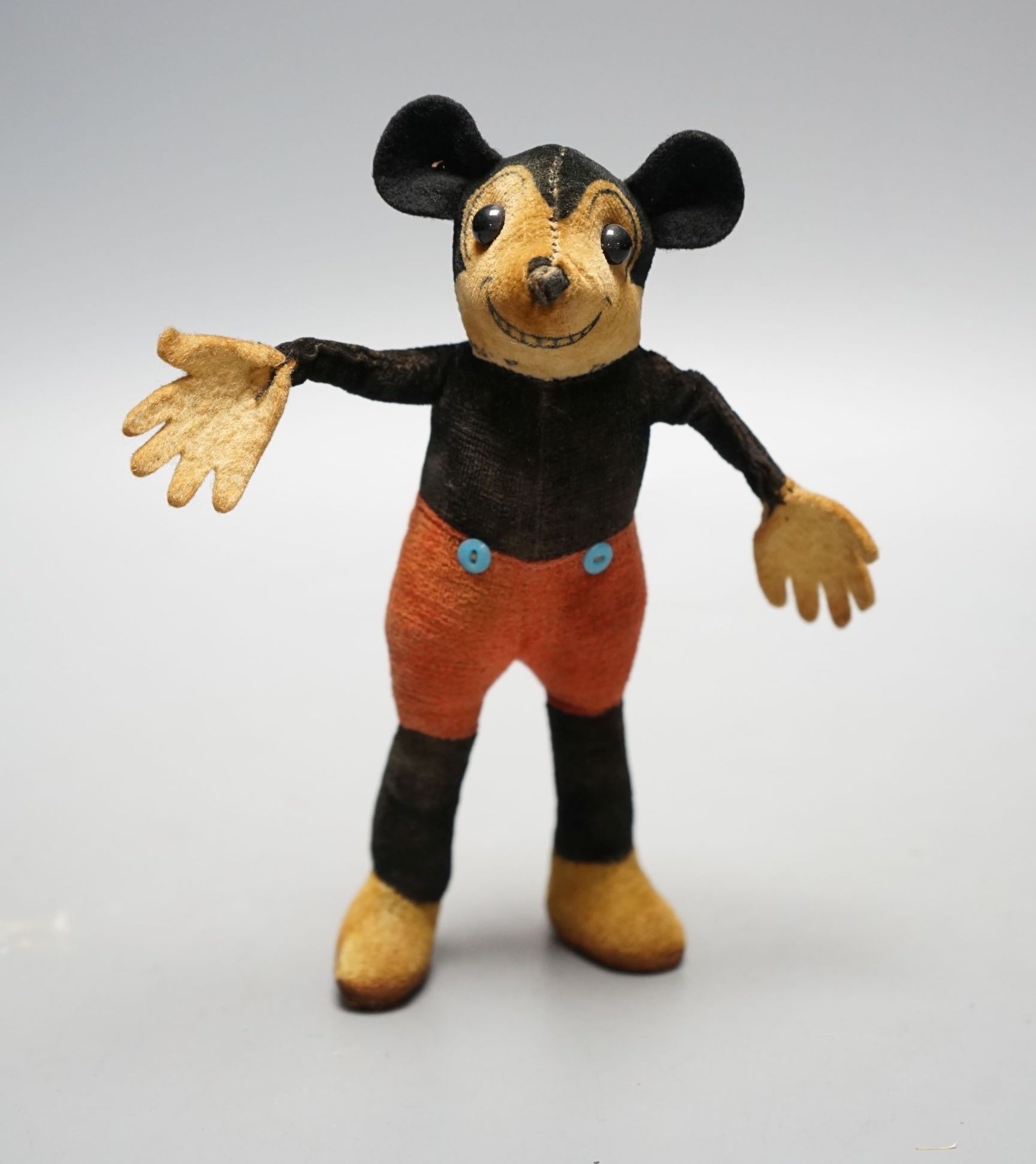 A 1930's Dean’s Ragbook felt and velvet model of Micky Mouse, 7 cms high.